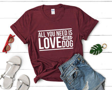 Load image into Gallery viewer, All You Need is Love and a Dog t shirts for women. Custom t shirts, ladies t shirts. Maroon shirt, tee shirts.