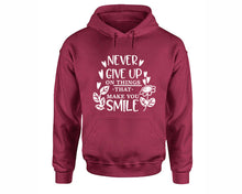 Load image into Gallery viewer, Never Give Up On Things That Make You Smile inspirational quote hoodie. Maroon Hoodie, hoodies for men, unisex hoodies
