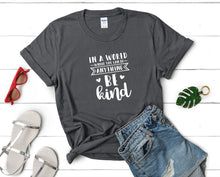 Load image into Gallery viewer, In a World Where You Can Be Anything Be Kind t shirts for women. Custom t shirts, ladies t shirts. Charcoal shirt, tee shirts.

